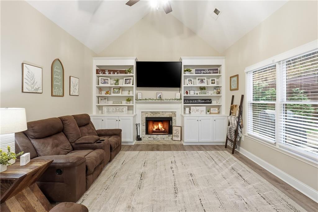 158 Pine Trail Dallas, GA 30157 - Photo 17 of 64 a living room with furniture a flat screen tv and a fireplace