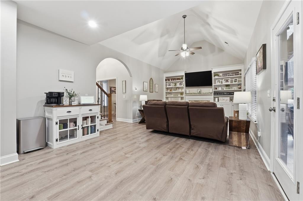 158 Pine Trail Dallas, GA 30157 - Photo 19 of 64 a living room with furniture a flat screen tv and a fireplace