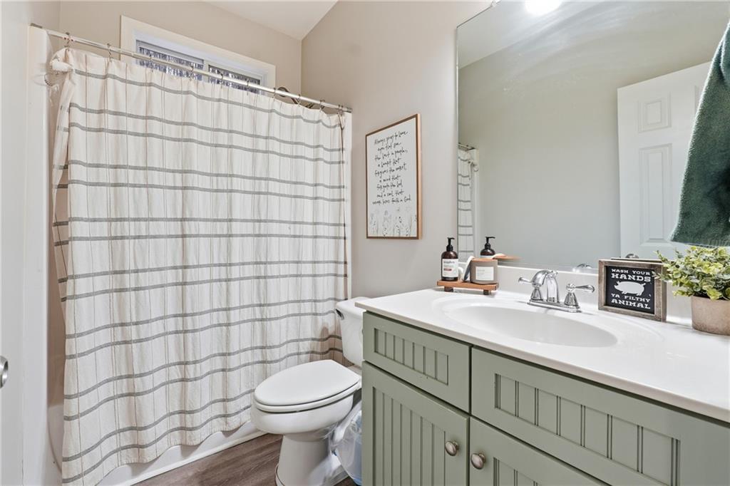 158 Pine Trail Dallas, GA 30157 - Photo 29 of 64 a bathroom with a sink a toilet and shower curtain