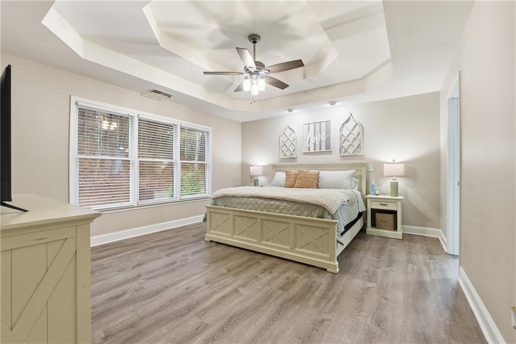 158 Pine Trail Dallas, GA 30157 - Photo 32 of 64 a spacious bedroom with a bed and a large window