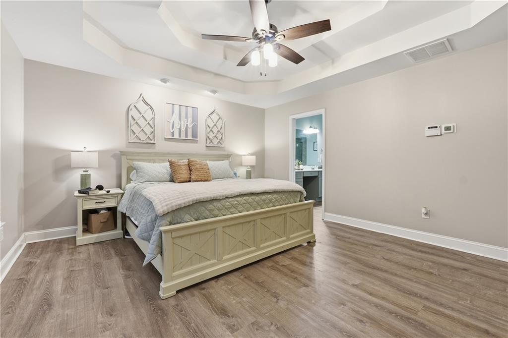 158 Pine Trail Dallas, GA 30157 - Photo 33 of 64 a bedroom with a bed and wooden floor