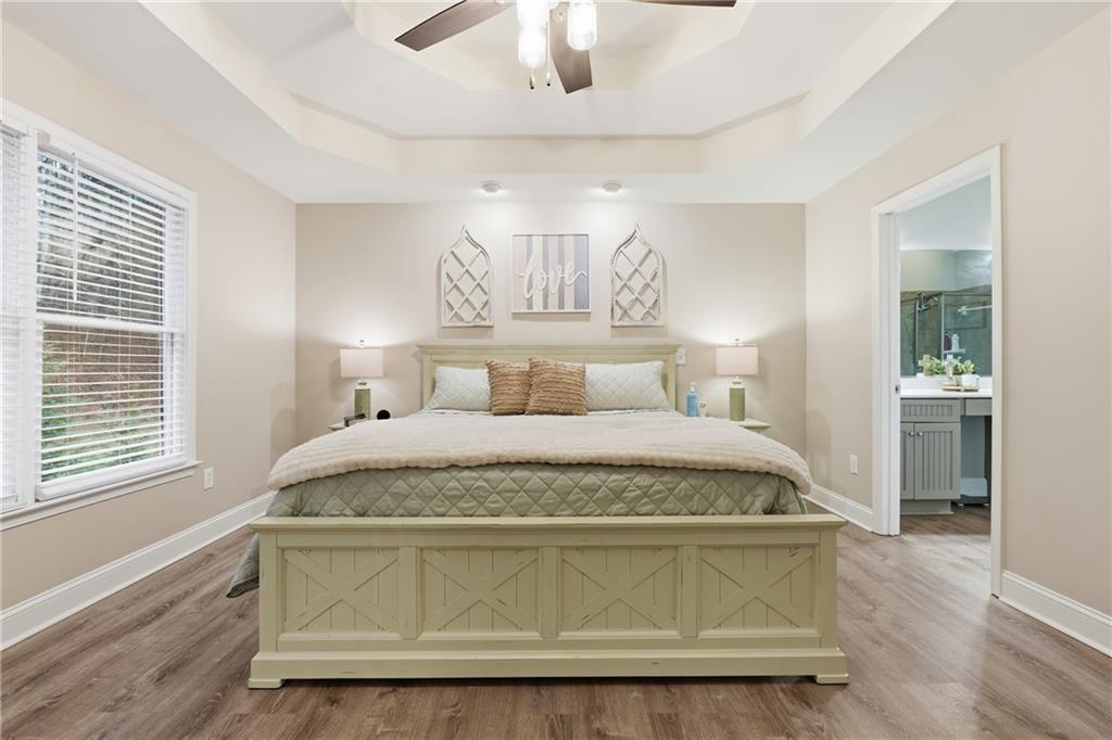 158 Pine Trail Dallas, GA 30157 - Photo 34 of 64 a bedroom with a bed and a chandelier