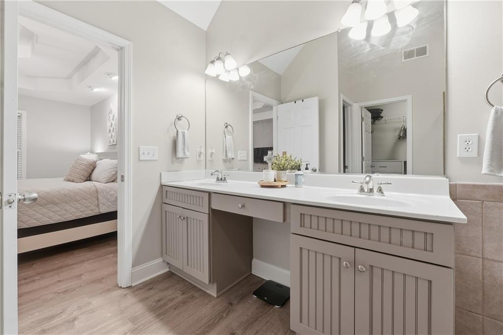 158 Pine Trail Dallas, GA 30157 - Photo 38 of 64 a en suite bathroom with a double vanity sink and a mirror