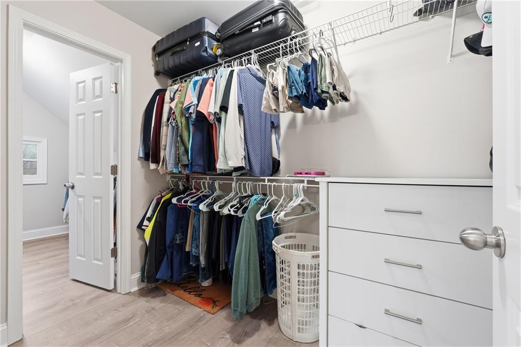 158 Pine Trail Dallas, GA 30157 - Photo 41 of 64 a view of walk in closet with clothes and shoes