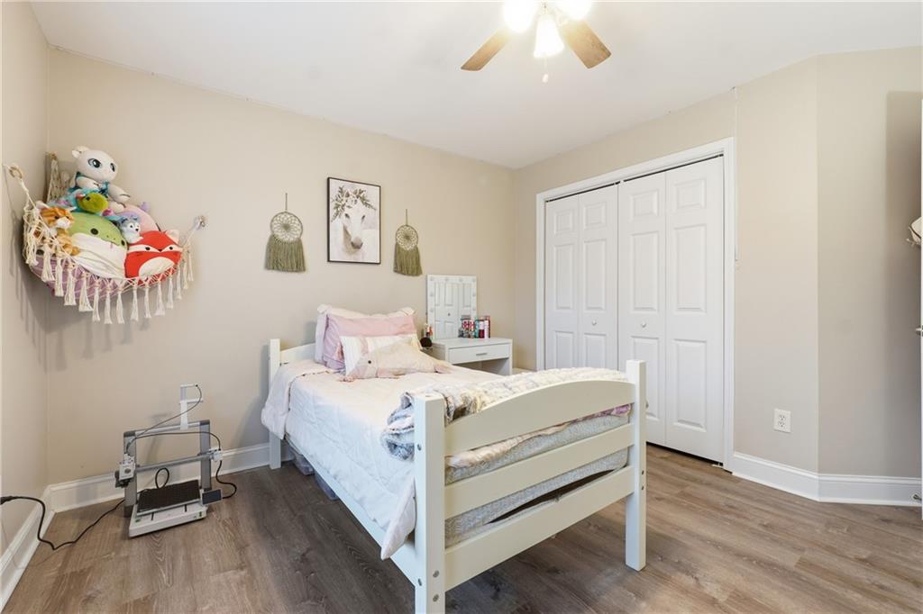 158 Pine Trail Dallas, GA 30157 - Photo 44 of 64 a bedroom with a bed and a chandelier