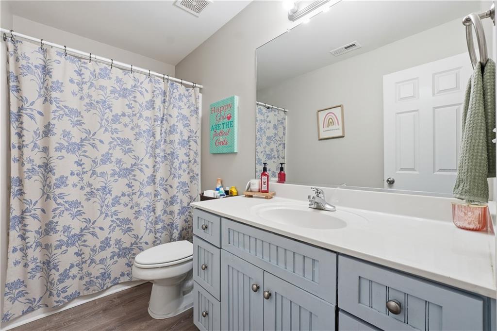 158 Pine Trail Dallas, GA 30157 - Photo 47 of 64 a bathroom with a sink a toilet and a mirror