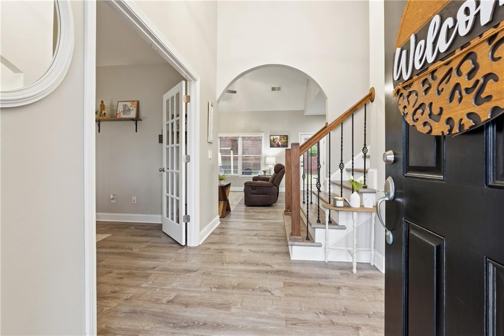 158 Pine Trail Dallas, GA 30157 - Photo 9 of 64 a view of entryway and hall with wooden floor