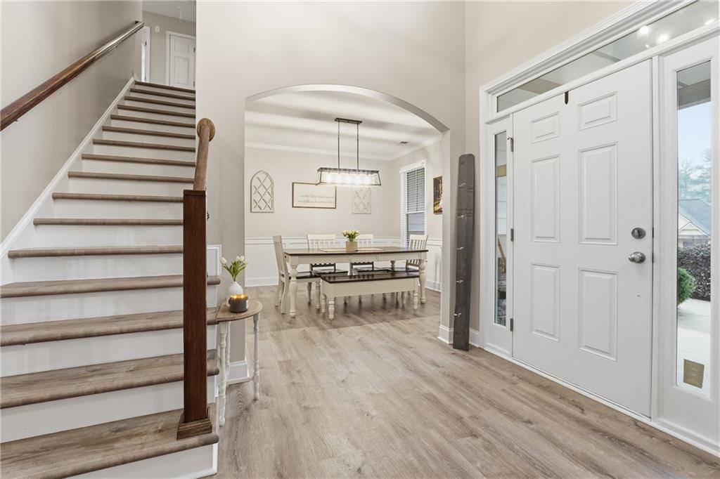 158 Pine Trail Dallas, GA 30157 - Photo 10 of 64 a view of a hallway with wooden floor and staircase