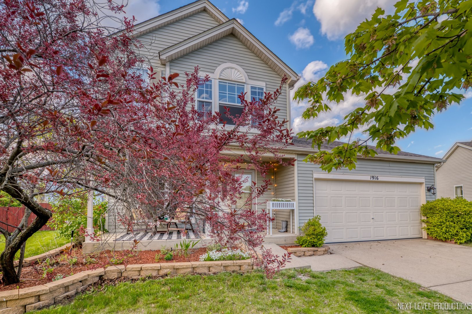 1916 Prairie Ridge Court Plainfield, IL 60586 - Photo 2 of 31 a front view of a house with garden