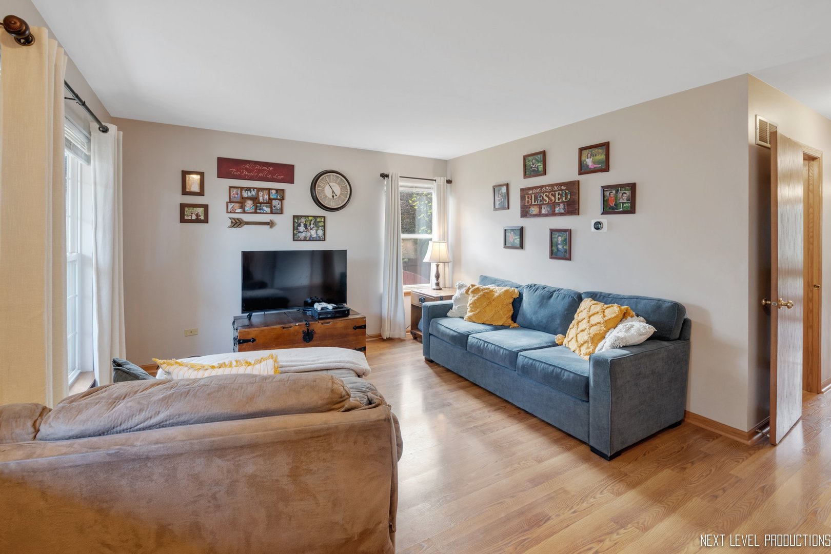 1916 Prairie Ridge Court Plainfield, IL 60586 - Photo 13 of 31 a living room with furniture and a flat screen tv