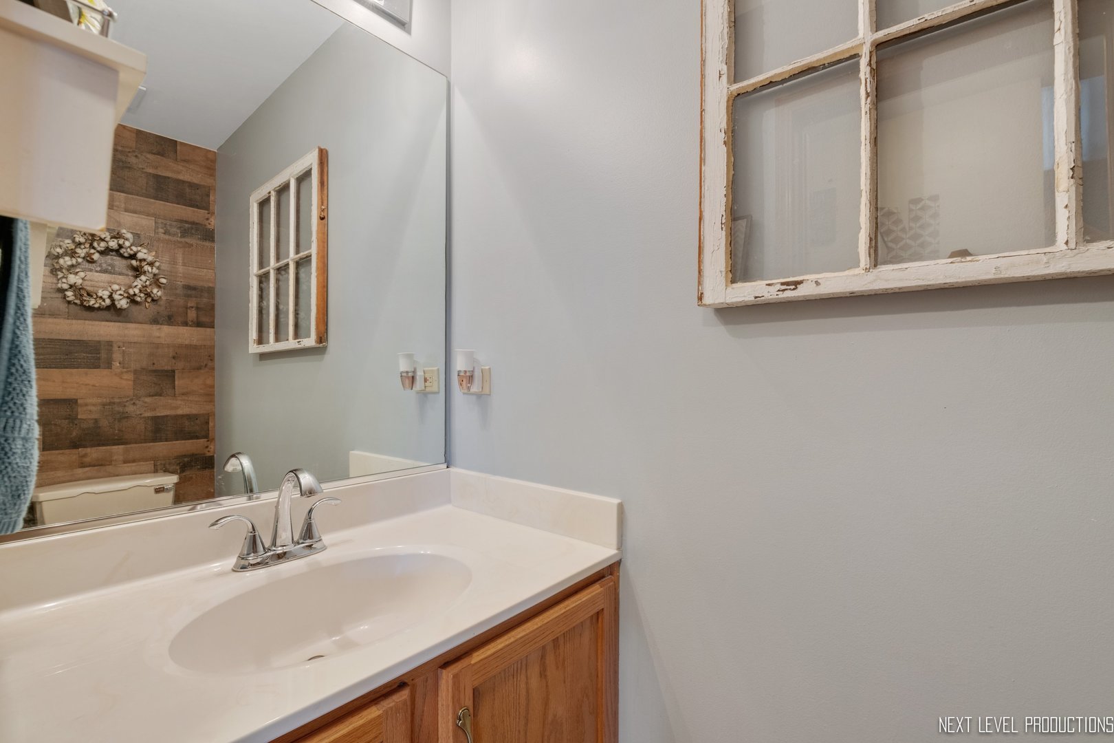 1916 Prairie Ridge Court Plainfield, IL 60586 - Photo 15 of 31 a bathroom with a sink and a mirror
