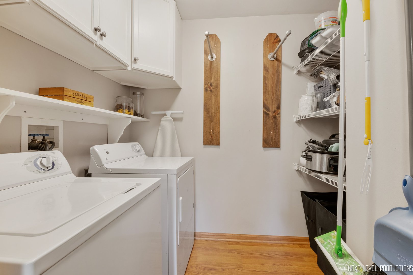 1916 Prairie Ridge Court Plainfield, IL 60586 - Photo 20 of 31 a view of washer and dryer with kitchen in the background
