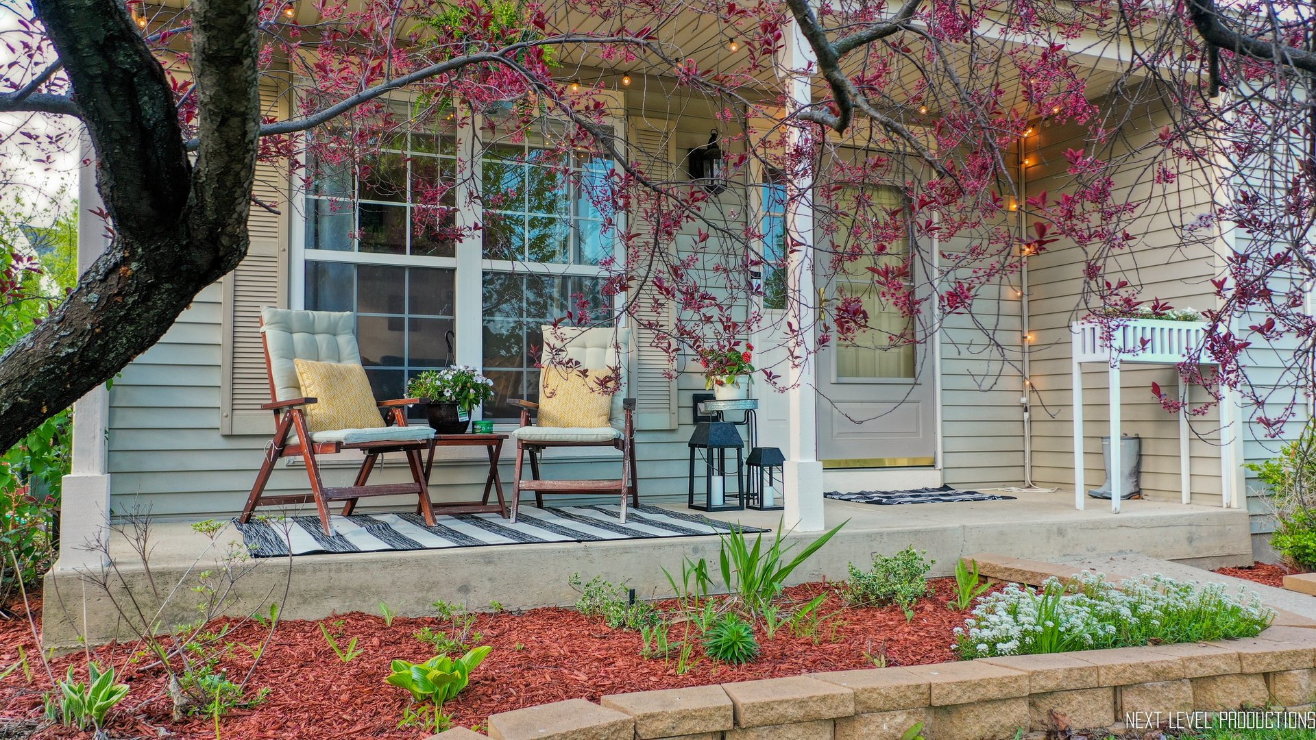 1916 Prairie Ridge Court Plainfield, IL 60586 - Photo 3 of 31 a view of a chair and table in the backyard with wooden fence