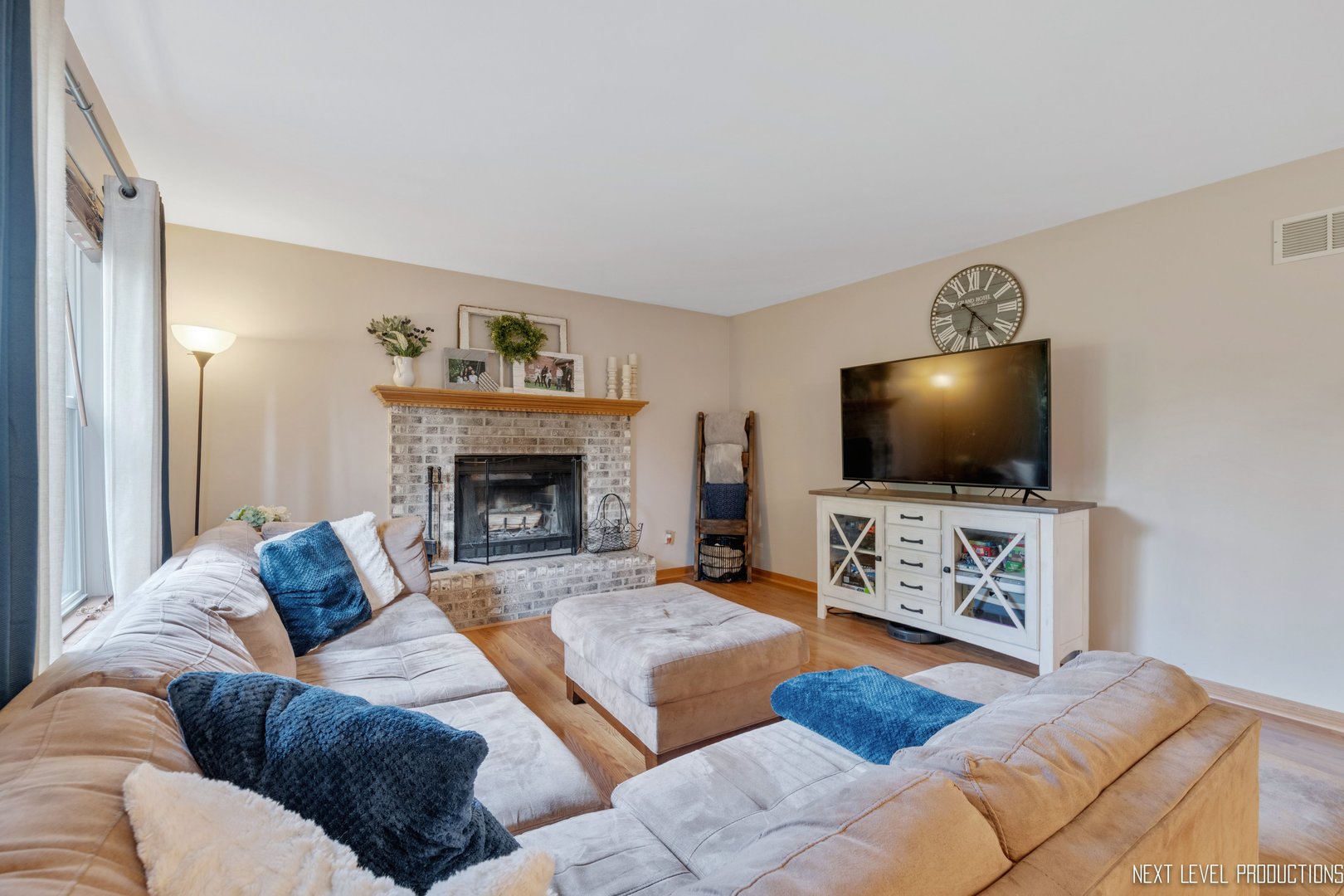 1916 Prairie Ridge Court Plainfield, IL 60586 - Photo 22 of 31 a living room with furniture and a flat screen tv