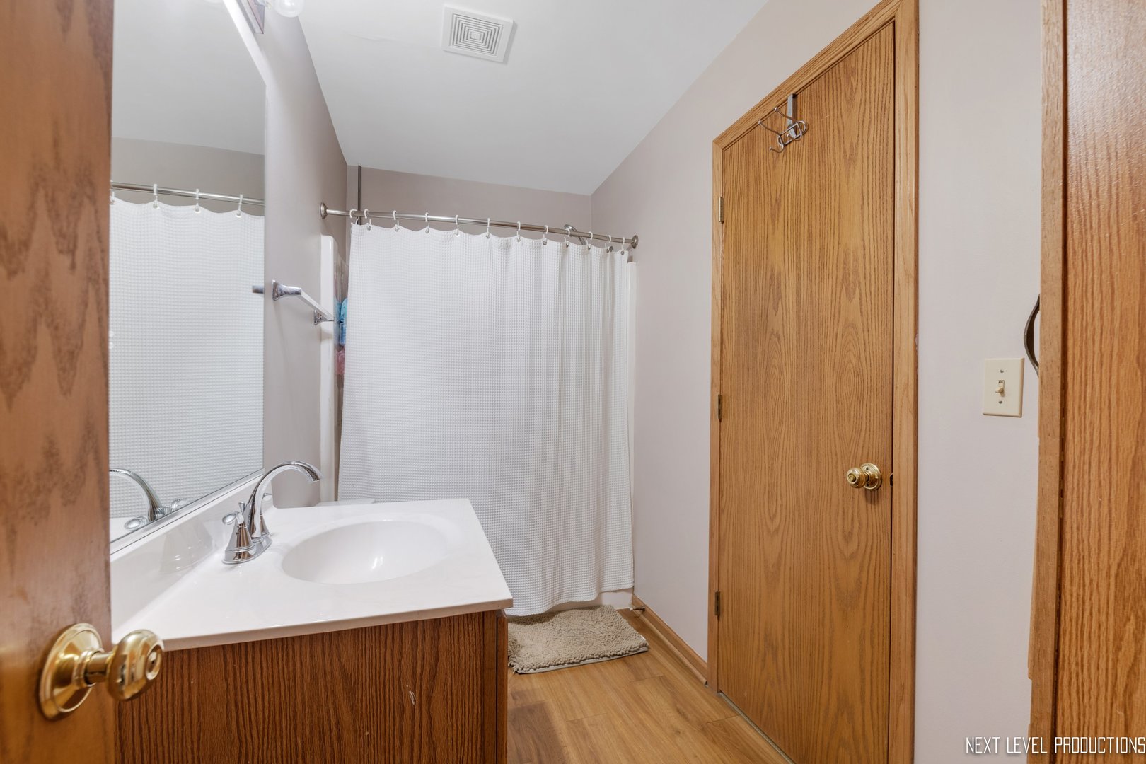 1916 Prairie Ridge Court Plainfield, IL 60586 - Photo 26 of 31 a bathroom with a granite countertop sink and a mirror