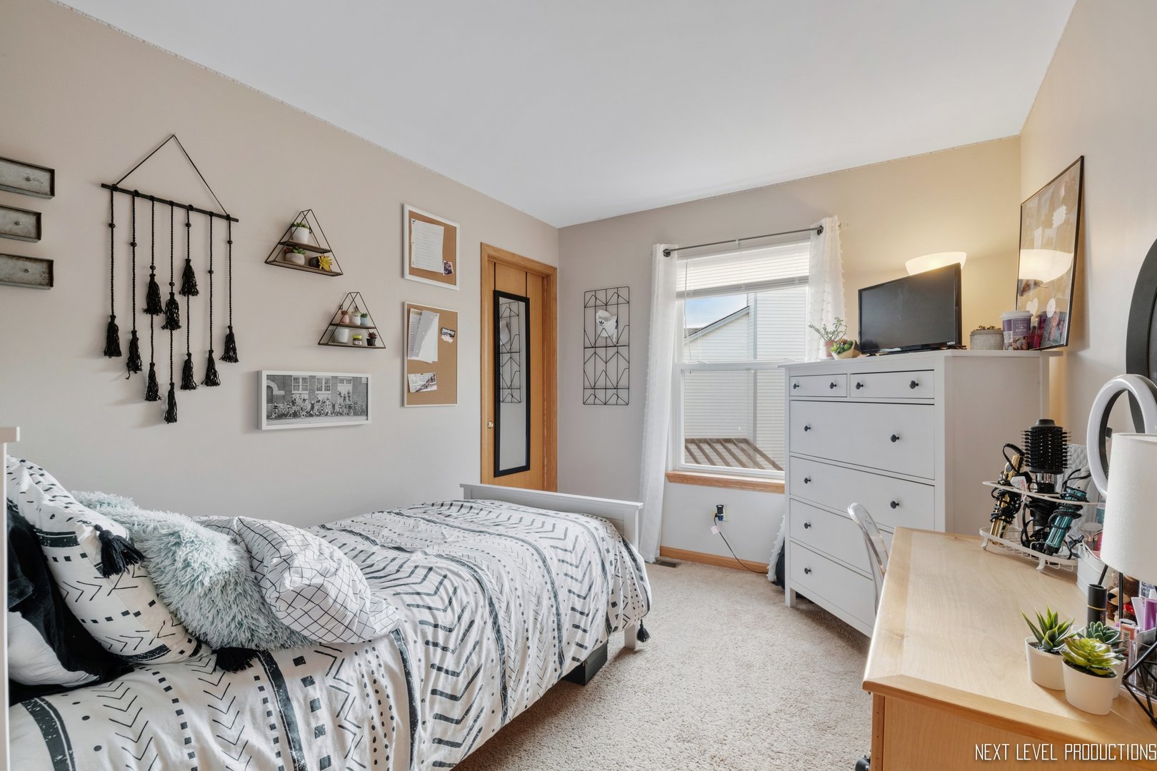 1916 Prairie Ridge Court Plainfield, IL 60586 - Photo 28 of 31 a bedroom with a bed and a flat screen tv