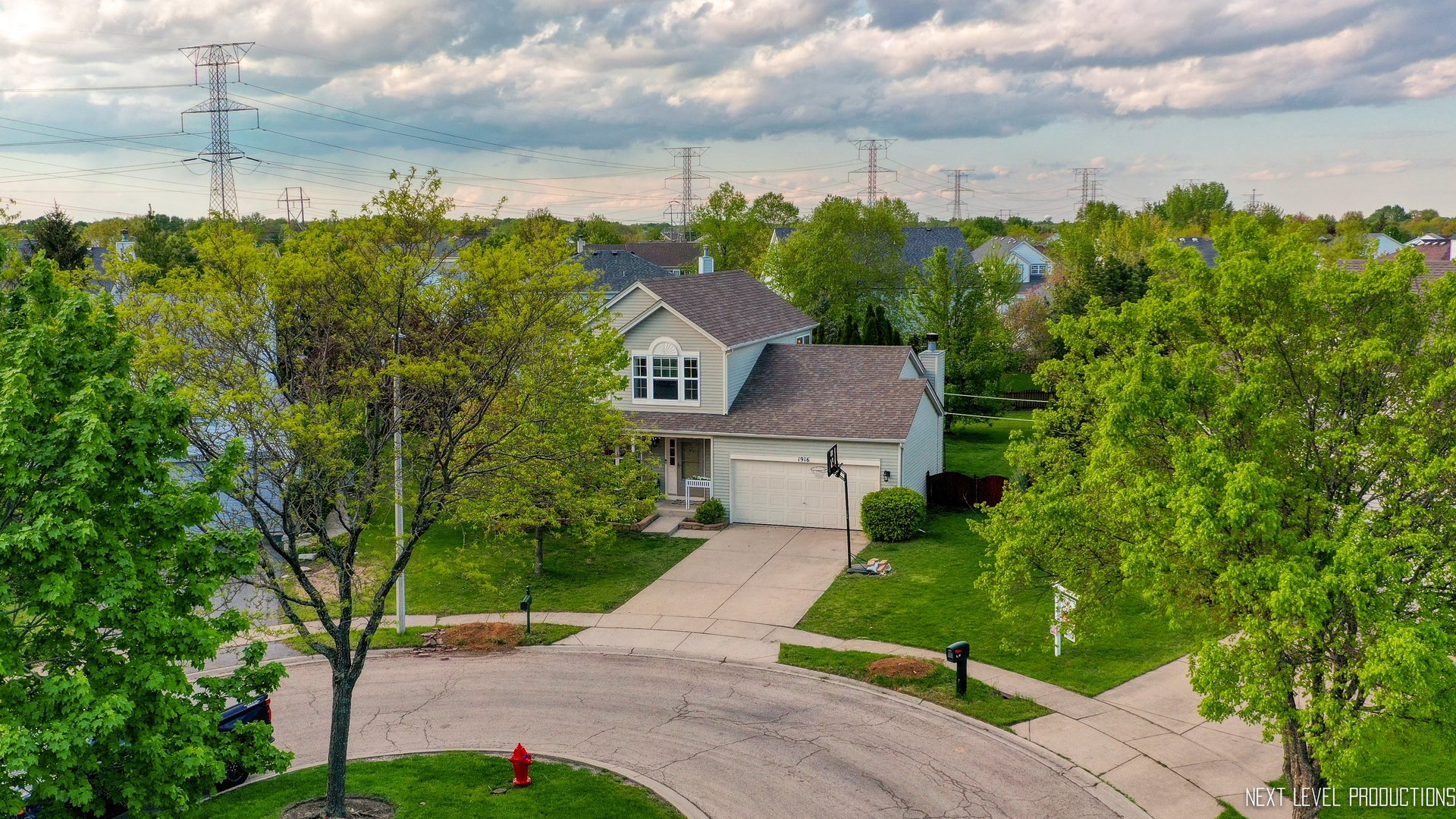1916 Prairie Ridge Court Plainfield, IL 60586 - Photo 4 of 31 a view of a garden with a building in the background
