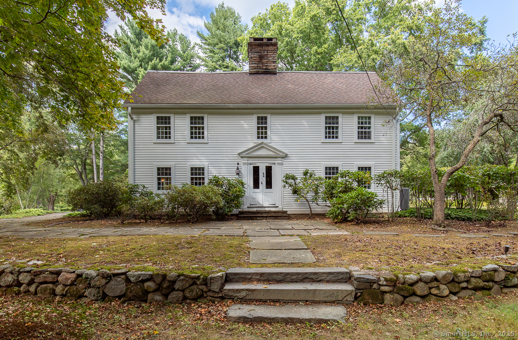 a aerial view of a house with a yard