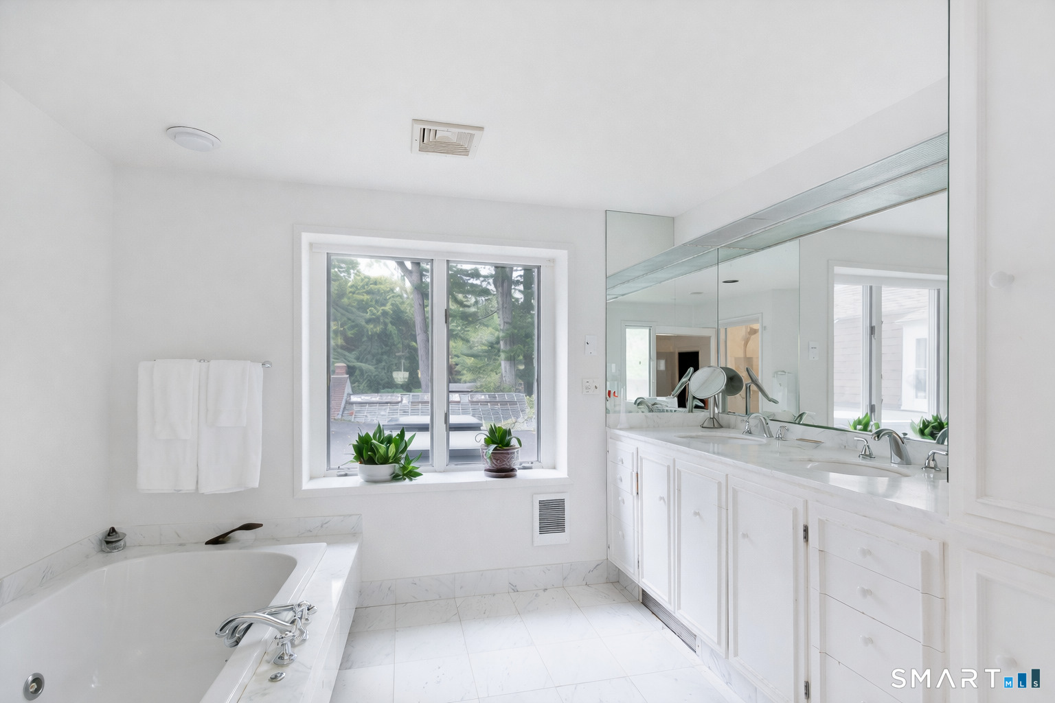 71 Beecher Road Woodbridge, CT 06525 - Photo 13 of 32 a bathroom with a granite countertop tub sink and mirror