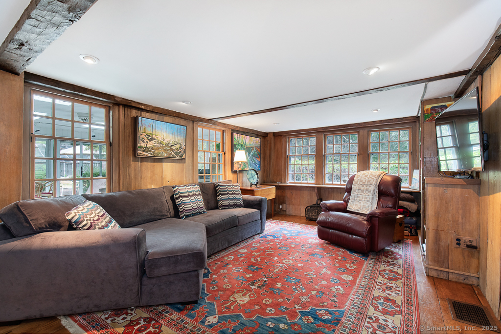 71 Beecher Road Woodbridge, CT 06525 - Photo 17 of 32 a living room with furniture and a large window