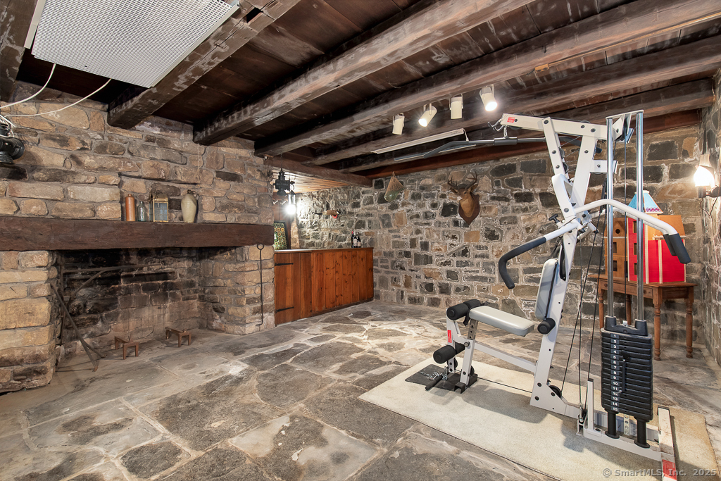 71 Beecher Road Woodbridge, CT 06525 - Photo 20 of 32 Rustic stone basement