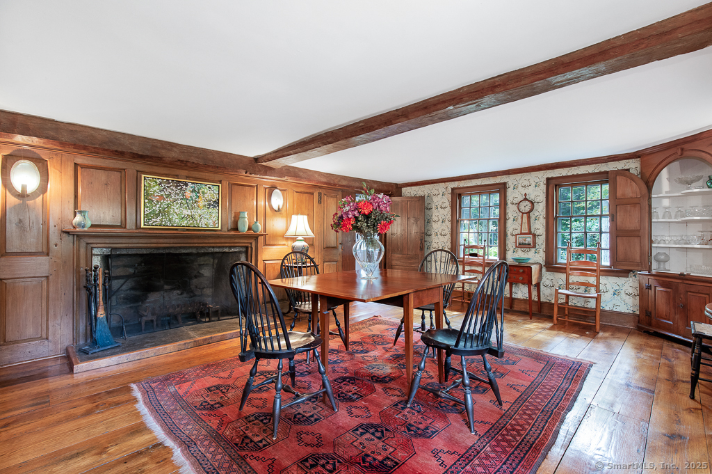 71 Beecher Road Woodbridge, CT 06525 - Photo 2 of 32 a view of a dining room with furniture window and wooden floor