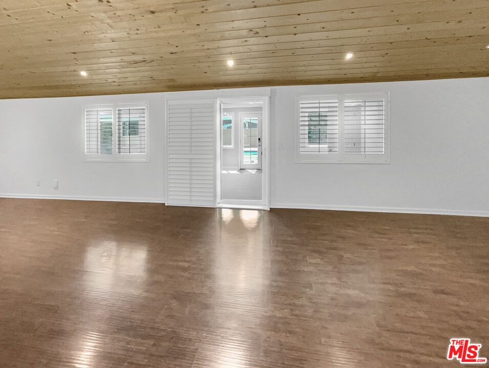 17530 Devonshire Street Northridge, CA 91325 - Photo 16 of 39 a view of a room with wooden floor