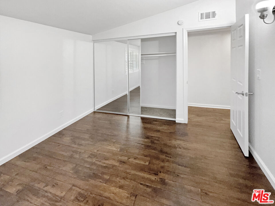 17530 Devonshire Street Northridge, CA 91325 - Photo 18 of 39 a view of a room with wooden floor