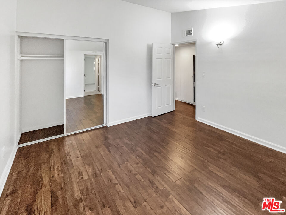 17530 Devonshire Street Northridge, CA 91325 - Photo 22 of 39 wooden floor in an empty room