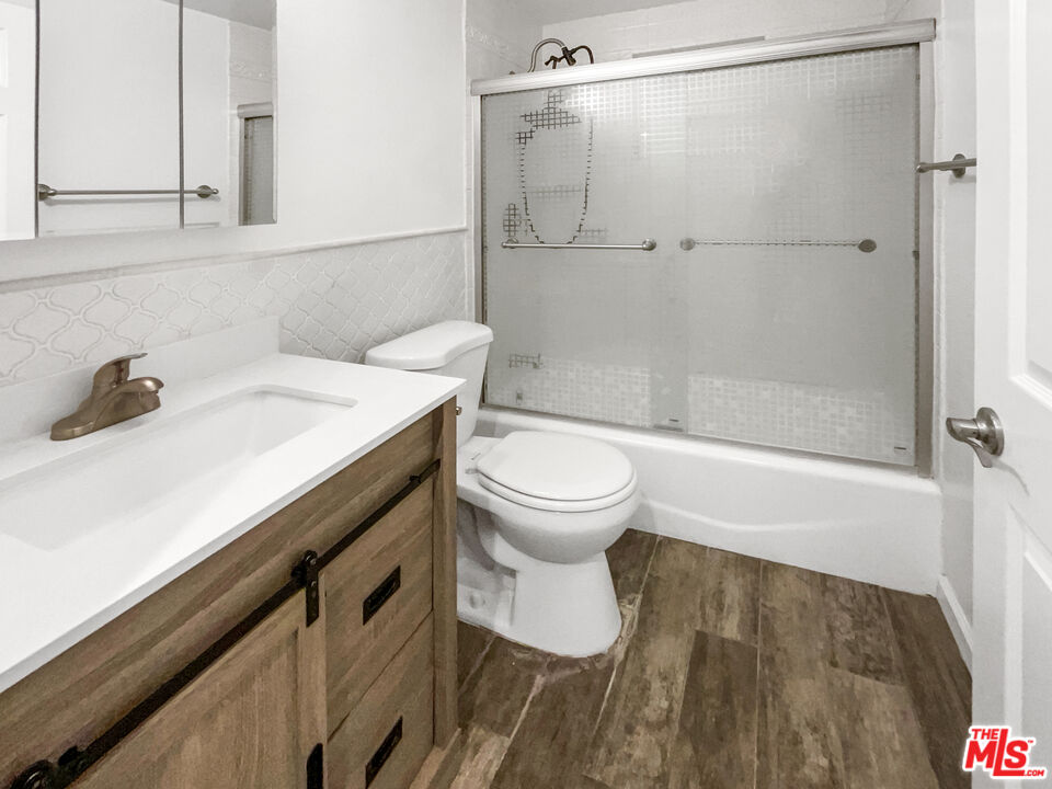 17530 Devonshire Street Northridge, CA 91325 - Photo 25 of 39 a bathroom with a sink toilet and shower