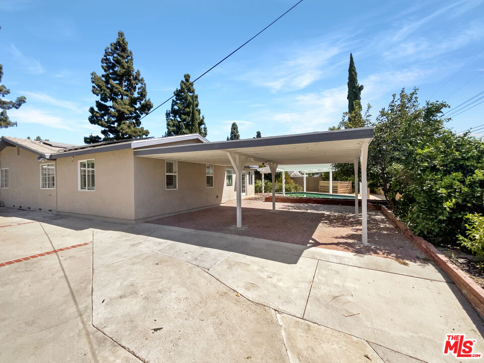 17530 Devonshire Street Northridge, CA 91325 - Photo 5 of 39 a front view of a house with a porch