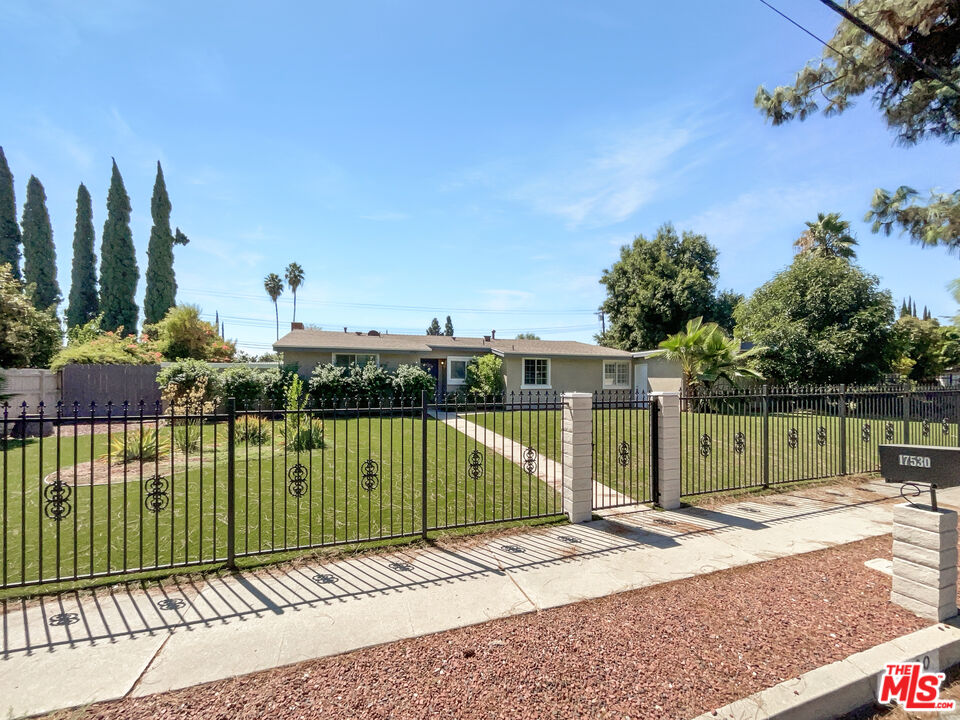 17530 Devonshire Street Northridge, CA 91325 - Photo 6 of 39 a view of a house with a terrace