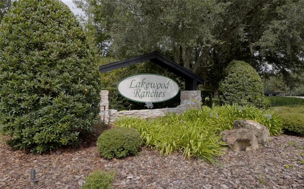 24148 Deep Springs Loop Eustis, FL 32736 - Photo 1 of 24 a view of a garden area with large trees
