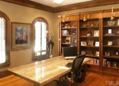 Main floor office/study with distressed cherry built-ins, adjoining powder room and whole house wiring system Other