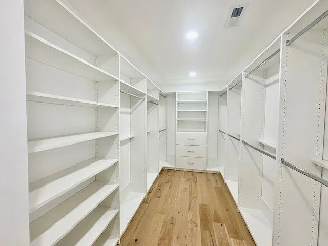 a view of an empty walk in closet