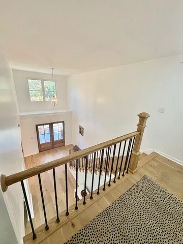 a view of a balcony with wooden floor