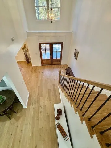 a living room with a bed furniture and a window