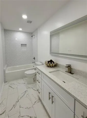 a view of a backyard with sitting area