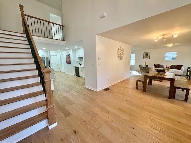 a view of a livingroom with furniture and staircase