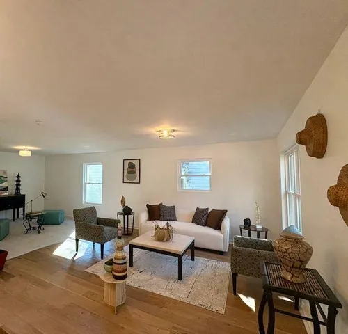 a living room with furniture and a table