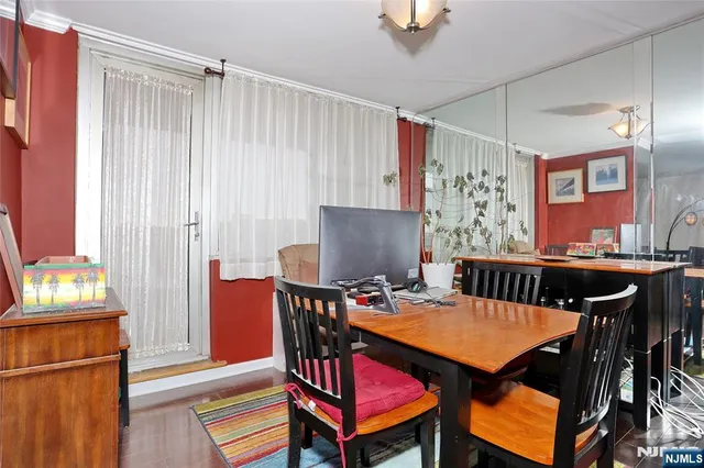 a view of a dining room with furniture and window
