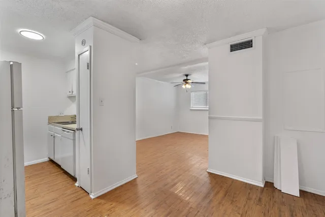 a kitchen with granite countertop a stove and a sink