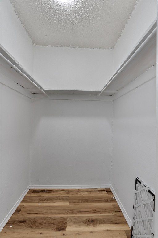 4103 Speedway, Unit 202 Austin, TX 78751 - Photo 10 of 13 Walk in closet with light wood-type flooring