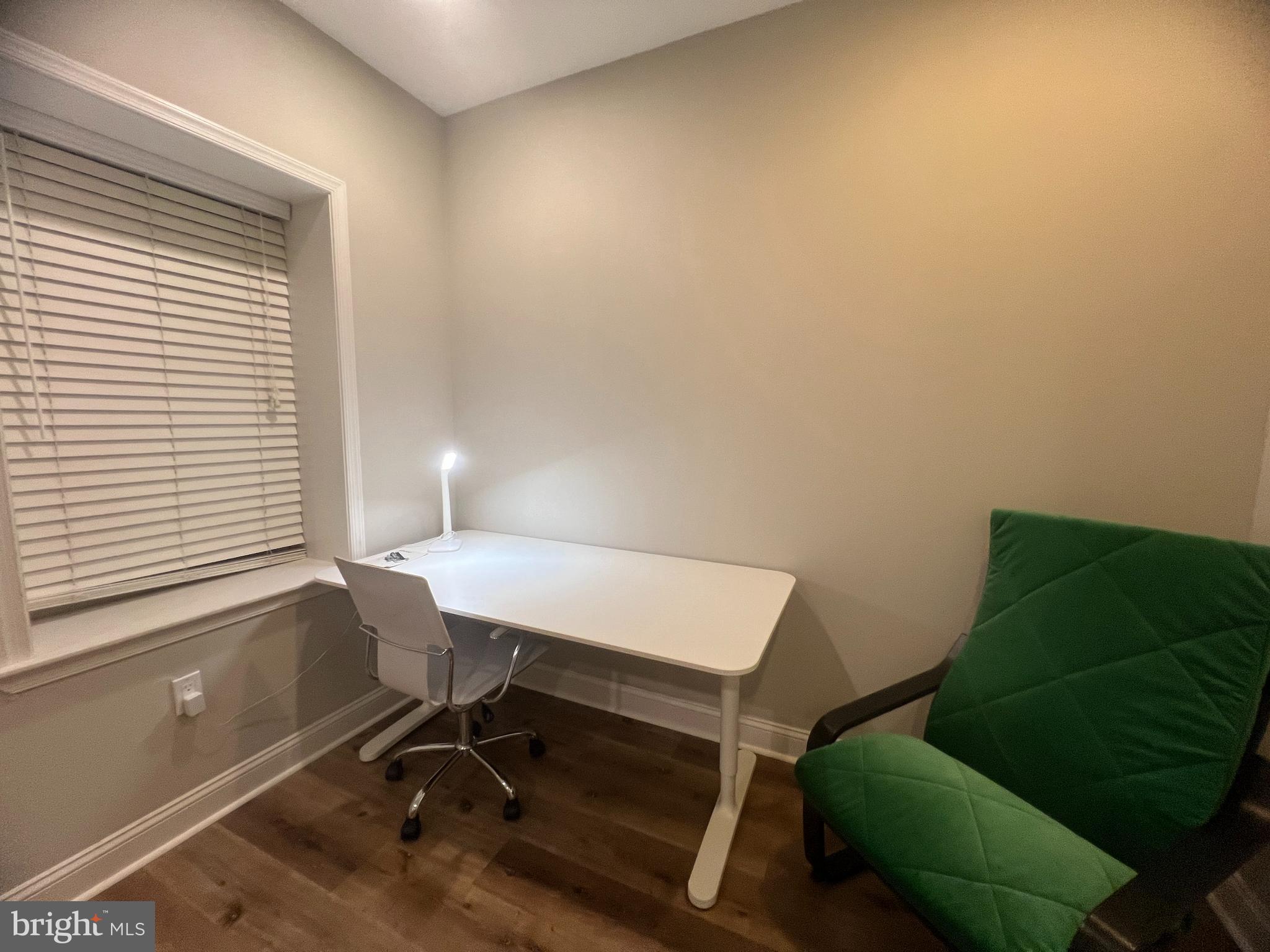 3802 Spring Garden Street Philadelphia, PA 19104 - Photo 11 of 26 a view of a workspace with furniture and a window
