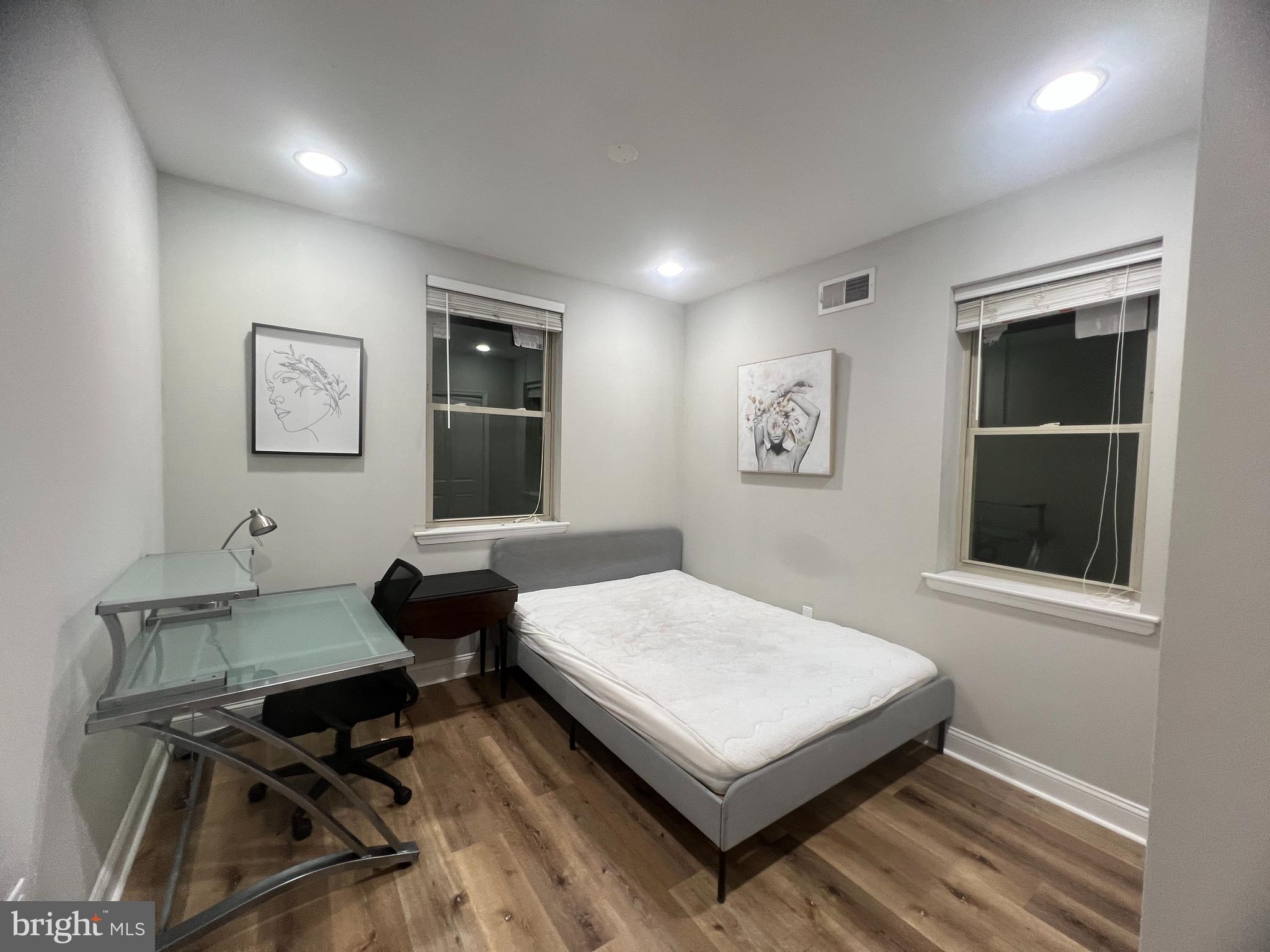 3802 Spring Garden Street Philadelphia, PA 19104 - Photo 15 of 26 a bedroom with a bed and a table