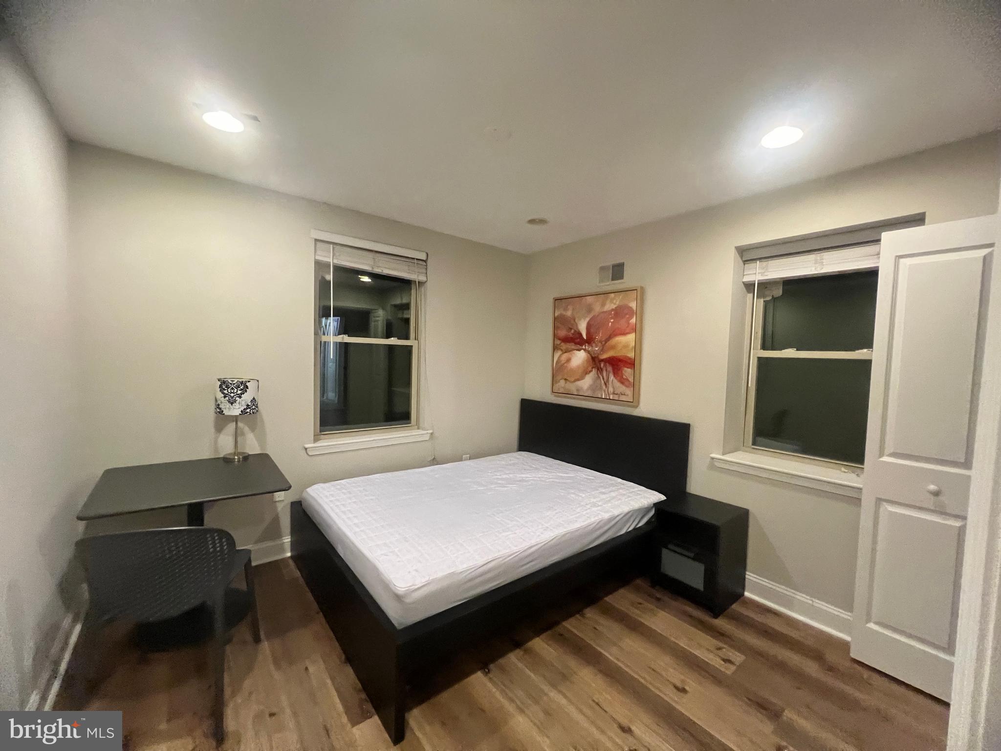 3802 Spring Garden Street Philadelphia, PA 19104 - Photo 17 of 26 a bedroom with a bed and a flat screen tv