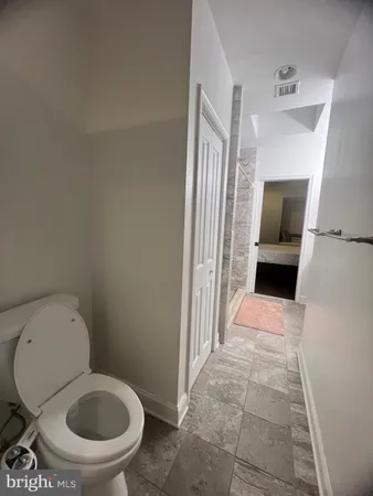 a bathroom with a toilet