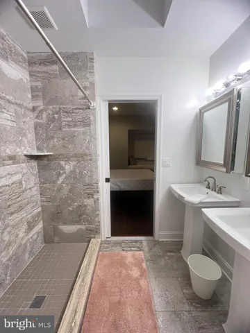 a bathroom with a sink and a mirror