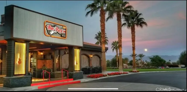 a view of a chairs and table in patio