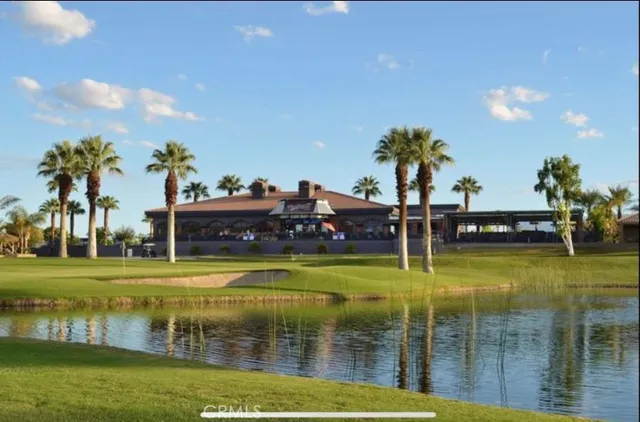 a view of houses with outdoor space and swimming pool